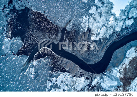 aerial view from icy river in winter 129157786