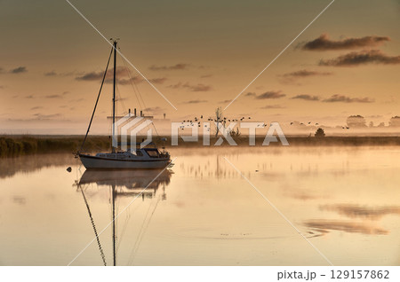 boat scenery on a foggy morning at baltic sea boat scenery on a foggy morning at baltic sea 129157862