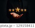 business hand with star rating 129158411