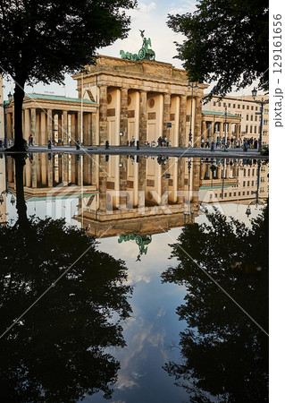 Famous Brandenburger Tor mirroring in a puddle Famous Brandenburger Tor mirroring in a puddle 129161656