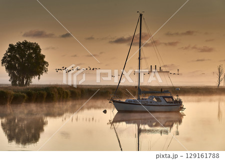 boat scenery on a foggy morning at baltic sea 129161788
