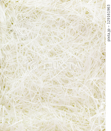 Texture of white paper filler. Shredded Paper Packing Material. White Spaghetti shredded packing paper used to protect fragile object while in transport. Backgrounds and Texture. Flat lay Texture of white paper filler. Shredded Paper Packing Material. White Spaghetti shredded packing paper used to protect fragile object while in transport. Backgrounds and Texture. Flat lay 129161963