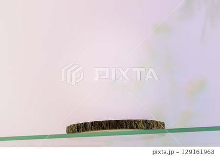 Wooden empty podium on glass shelf on beauty gradient background. Round show case for natural cosmetic products. Concept scene stage for new product, promotion sale and presentation. Low angle Wooden empty podium on glass shelf on beauty gradient background. Round show case for natural cosmetic products. Concept scene stage for new product, promotion sale and presentation. Low angle 129161968