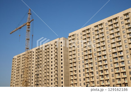 A Modern Apartment Building is Currently Under Construction in an Urban Environment 129162186