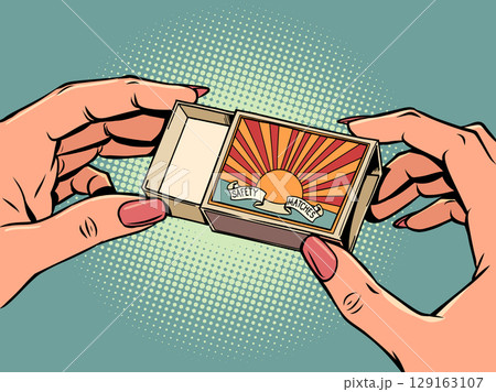 Women's hands holding a matchbox. Items for a hike, tourist explorer. Hot sale and discounts. Women's hands holding a matchbox. Items for a hike, tourist explorer. Hot sale and discounts. 129163107