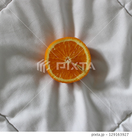 White Fabric And Cutted In Half Orange Fruit On It Detailed Stock Photo White Fabric And Cutted In Half Orange Fruit On It Detailed Stock Photo 129163927