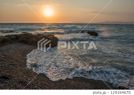Aegean sea sunset beach sea Rhodes, Greece Aegean sea sunset beach sea Rhodes, Greece 129164670