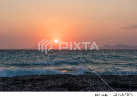 Aegean sea sunset beach sea Rhodes, Greece Aegean sea sunset beach sea Rhodes, Greece 129164676