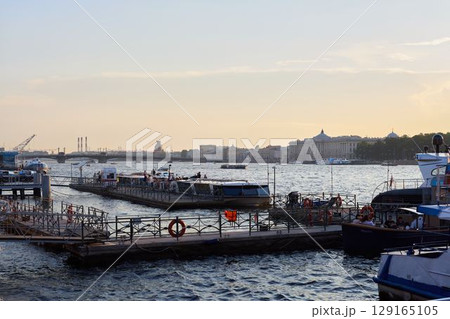 A beautiful view of the Scenic City Dock with Boats gracefully floating at Sunset time 129165105