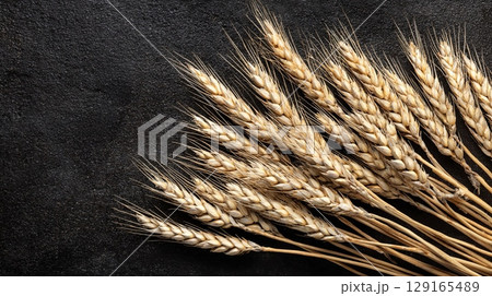 Wheat Spikes on Black Table Flat Lay Wheat Spikes on Black Table Flat Lay 129165489