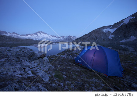 Tent at Oberer Schwarzhornsee lake with Hochalmspitze 3360 m, National Park Hohe Tauern, Carinthia, Austria 129165798