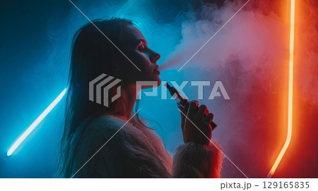 Woman Vaping in Neon Lights, Exhaling Vapor 129165835