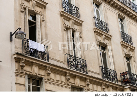The Elegant and Iconic Parisian Architecture Enhanced by Beautiful Classic Balconies The Elegant and Iconic Parisian Architecture Enhanced by Beautiful Classic Balconies 129167828