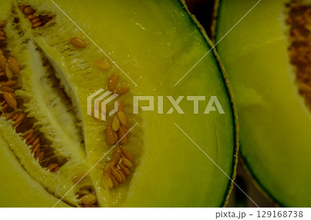 Cut in half cantaloupe melon isolated on white background Cut in half cantaloupe melon isolated on white background 129168738