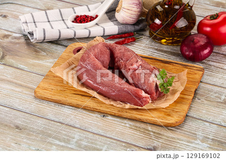 Raw pork tenderloin for cooking 129169102