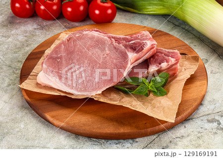 Raw pork steak loin with bone 129169191