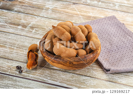 Tropical exotic Tamarind fruit heap 129169217