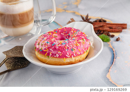 Sweet donut with strawberry icing 129169269