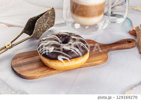 Delicous sweet donut with chocolate glaze 129169270