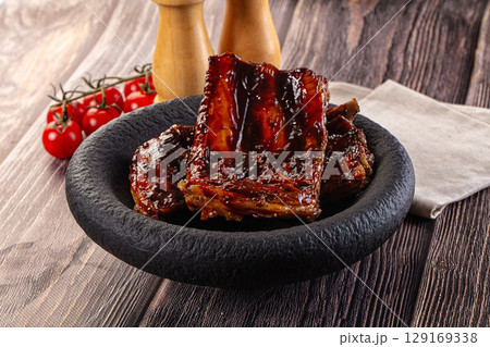 Grilled pork ribs with barbecue sauce Grilled pork ribs with barbecue sauce 129169338