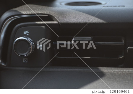 interior view of car with black leather, closeup car air conditional vents interior view of car with black leather, closeup car air conditional vents 129169461