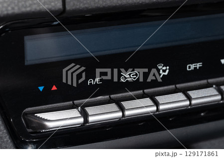 Climate control buttons in modern car 129171861