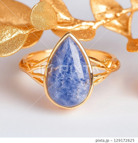 Elegant Gold Ring with Teardrop Sapphire Gemstone and Leaf Design 129172625