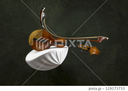 Abstract still life with a violin stretched out in space 129173733