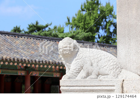 Stone statue of mythical creature and roof of ancient pavilion, Gyeongbokgung palace complex, Seoul, South Korea. Topic of summer vacation, travel, trip abroad, cruises and tours Stone statue of mythical creature and roof of ancient pavilion, Gyeongbokgung palace complex, Seoul, South Korea. Topic of summer vacation, travel, trip abroad, cruises and tours 129174464