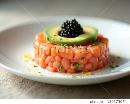 Elegant Salmon Tartare with Black Caviar, Avocado, and Herbs 129175074