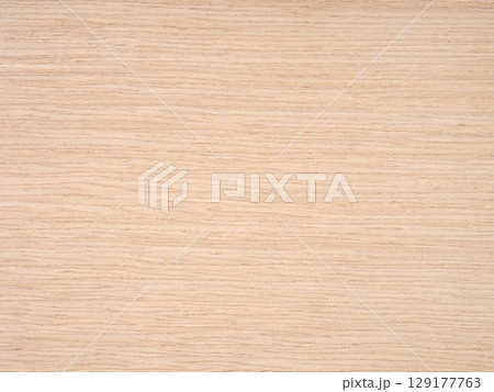 A harmonious blend of sandy beige and soft golden hues across a smooth oak wood veneer 129177763
