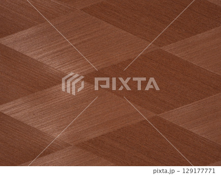 Rich mahogany veneer in a herringbone design with a luxurious polished finish 129177771