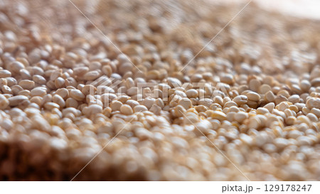 Close-up of raw quinoa in a glass jar. Superfood. Storage concept Close-up of raw quinoa in a glass jar. Superfood. Storage concept 129178247
