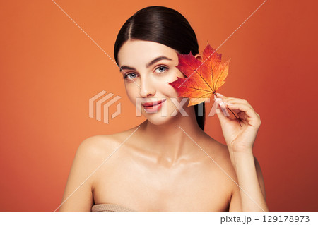 Autumn portrait of beautiful woman with clean fresh skin Autumn portrait of beautiful woman with clean fresh skin 129178973