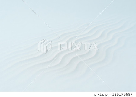 Sand waves on a clear background. Space for text. 129179687