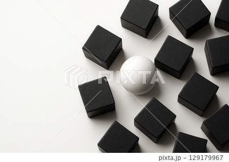 A white ball among black cubes on a white background. Space for text. A white ball among black cubes on a white background. Space for text. 129179967