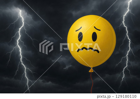 A sad balloon in a thundercloud. Space for text. A sad balloon in a thundercloud. Space for text. 129180110