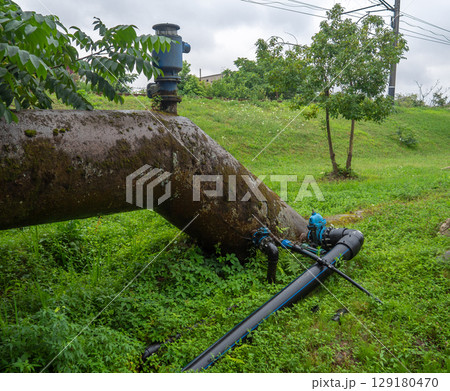 Valves on the gas pipeline. Gas cover. Transportation of fuel through the pipe. Village gas supply. Industry. E Embedded new line into old pipe 129180470