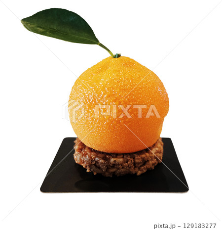Homemade fresh orange cake and cream on chocolate Hazelnut on black plate isolated on white background with clipping path Homemade fresh orange cake and cream on chocolate Hazelnut on black plate isolated on white background with clipping path 129183277