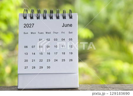 June 25 calendar with blurred nature background. Copy space 129183690
