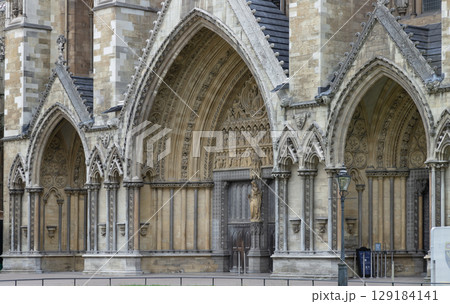 the elaborately carved North Entrance of Westminster Abbey (the Great North Door) is characterized by its Gothic architectural style. 129184141