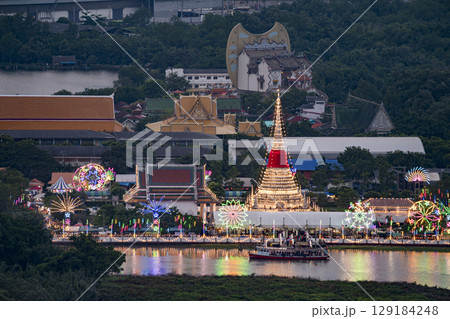 Beautiful night festival scene of Wat Phra Samut Chedi temple with lighting on the Chao Phraya river during sunset in Samut Prakan, Province, Thailand. Beautiful night festival scene of Wat Phra Samut Chedi temple with lighting on the Chao Phraya river during sunset in Samut Prakan, Province, Thailand. 129184248