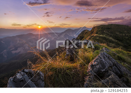 Sunset at Doi Pha Tang, Chiang Rai, Thailand. 129184255