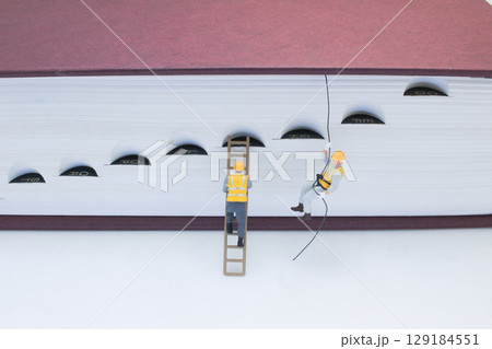 A Miniature Workers With Dictionary Illustrating Conceptual A Miniature Workers With Dictionary Illustrating Conceptual 129184551