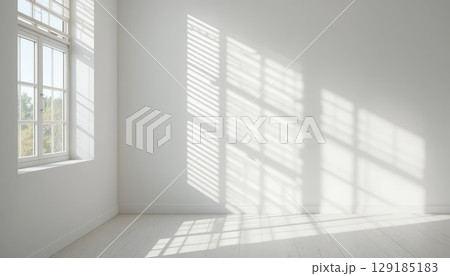 Bright Empty Room with Sunlight Streaming Through Large Windows. Bright Empty Room with Sunlight Streaming Through Large Windows. 129185183
