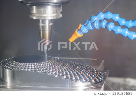 The CNC milling machine finish cut the mold parts by solid ball nose end mill tool. The CNC milling machine finish cut the mold parts by solid ball nose end mill tool. 129185689