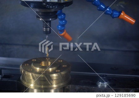 The deep hole drilling process the brass material parts on CNC milling machine. The deep hole drilling process the brass material parts on CNC milling machine. 129185690