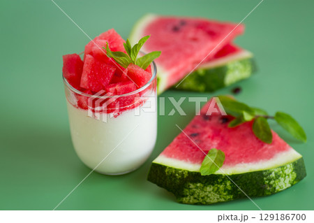 Morning yogurt with watermelon slices and fresh mint leaves 129186700