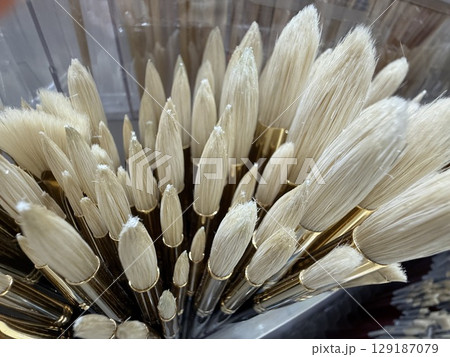 Closeup of artist paintbrushes with natural bristles in various sizes and shapes Closeup of artist paintbrushes with natural bristles in various sizes and shapes 129187079