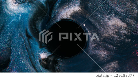 Glitter paint. Blur sparkling art. Defocused blue color water round frame liquid wet texture portal on abstract dark black creative background. 129188377